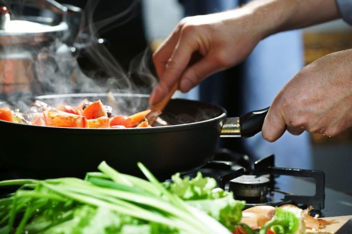 a man using nonstick pan in the kitchen